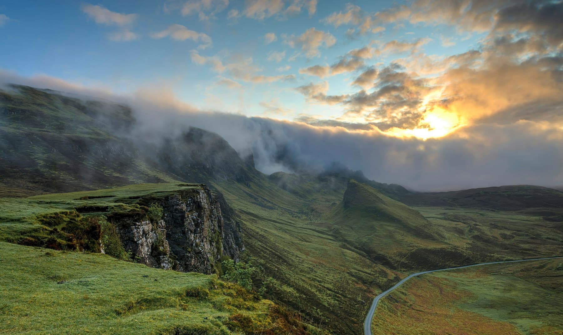 A highland road at first light.